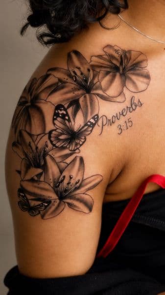 Black & Grey + Floral lilies tattoo on Shoulder by without.a.trece on TattMe