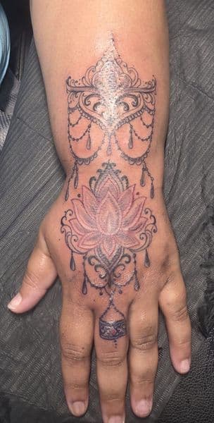 Fine Line + Black & Grey lotus tattoo on Hand by TattzByWolf on TattMe