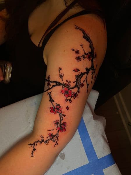 Japanese + Floral cherry blossoms tattoo on Upper Arm by jules.inkz on TattMe