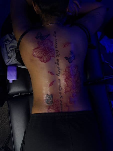 Floral + Illustrative flowers tattoo on Spine by 719sFineLinez on TattMe