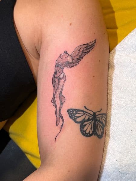 Fine Line + Black & Grey winged figure tattoo on Upper Arm by CJSCHULTZ on TattMe
