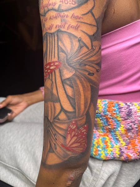 Black & Grey + Color lilies tattoo on Upper Arm by rich_inkq on TattMe