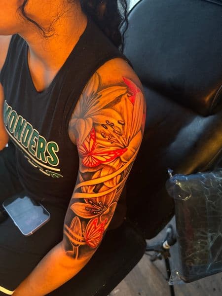Floral + Color lilies tattoo on Half Sleeve by rich_inkq on TattMe