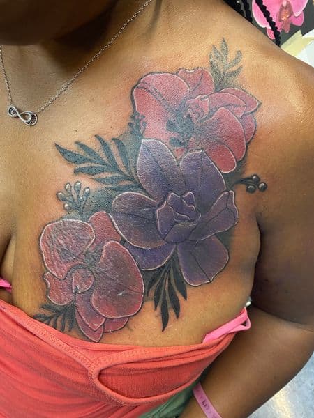 Color + Floral flowers tattoo on Chest by Tony_Hustle_215 on TattMe