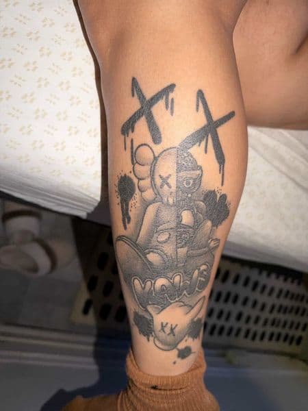 Pop Culture + Black & Grey kaws tattoo on Calf by Tony_Hustle_215 on TattMe