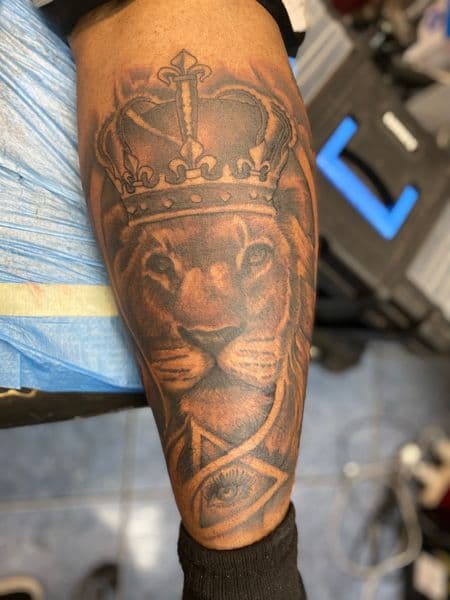 Black & Grey + Illustrative lion tattoo on Forearm by Tony_Hustle_215 on TattMe