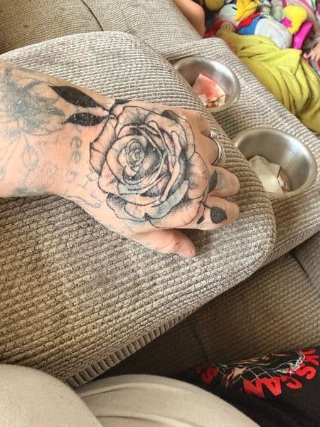 Black & Grey + Floral rose tattoo on Hand by feral_beauty on TattMe