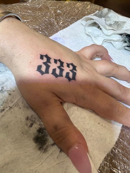 Lettering + Gothic numbers tattoo on Hand by CodyWithTatForge on TattMe