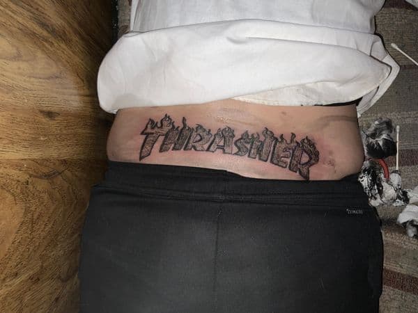 Lettering + Black-work thrasher tattoo on Lower Back by CodyWithTatForge on TattMe