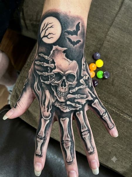 Black & Grey + Realism skull tattoo on Hand by CodyWithTatForge on TattMe
