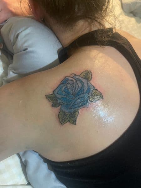Color + Floral rose tattoo on Shoulder Blade by CodyWithTatForge on TattMe