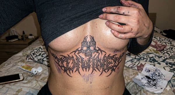 Black-work + Lettering skull tattoo on Sternum by Avery_ink on TattMe