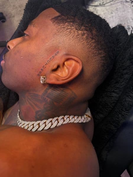 Lettering + Fine Line lettering tattoo on Face by TattooHut on TattMe