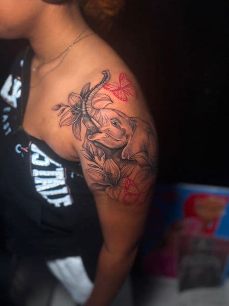 Black & Grey + Floral elephant tattoo on Shoulder by TattooHut on TattMe