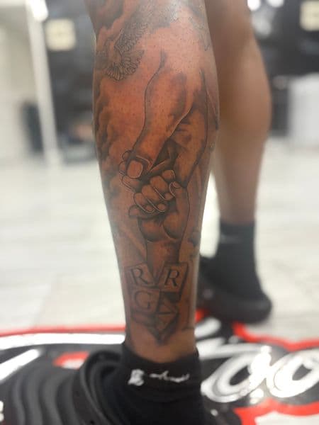 Black & Grey + Realism hands tattoo on Calf by TattooHut on TattMe