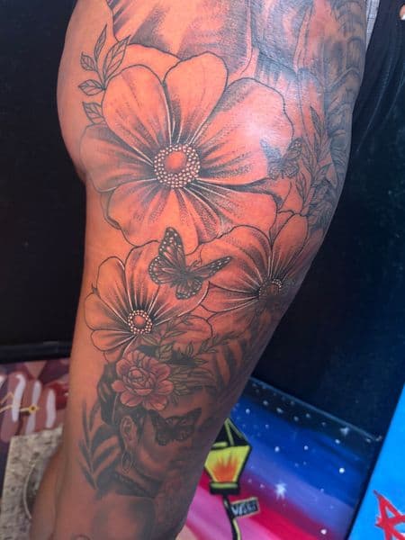 Floral + Black & Grey flowers tattoo on Thigh by TattooHut on TattMe