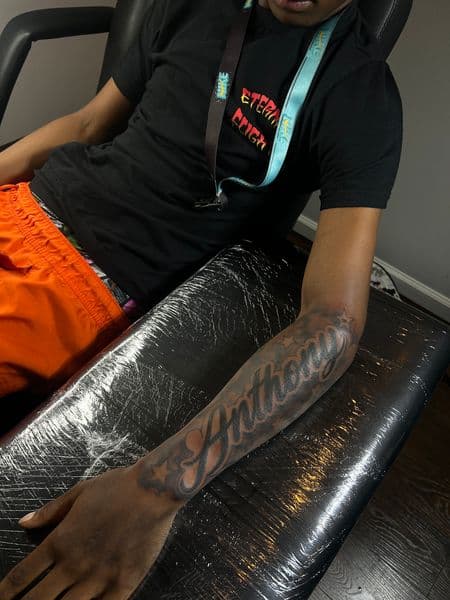 Lettering + Black & Grey anthony tattoo on Forearm by inkedonmarz on TattMe