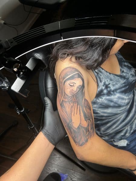 Black & Grey + Chicano virgin mary tattoo on Upper Arm by inkedonmarz on TattMe