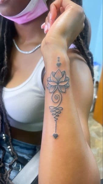 Fine Line + Black-work lotus tattoo on Forearm by sam on TattMe