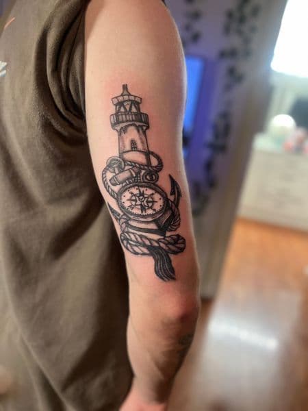Traditional + Black & Grey lighthouse tattoo on Upper Arm by Mindful_Essence_Tattoo on TattMe