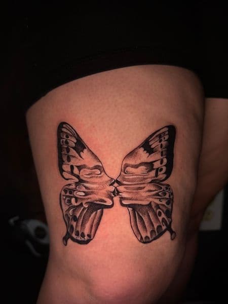 Black & Grey + Illustrative butterfly tattoo on Thigh by nanisiink on TattMe