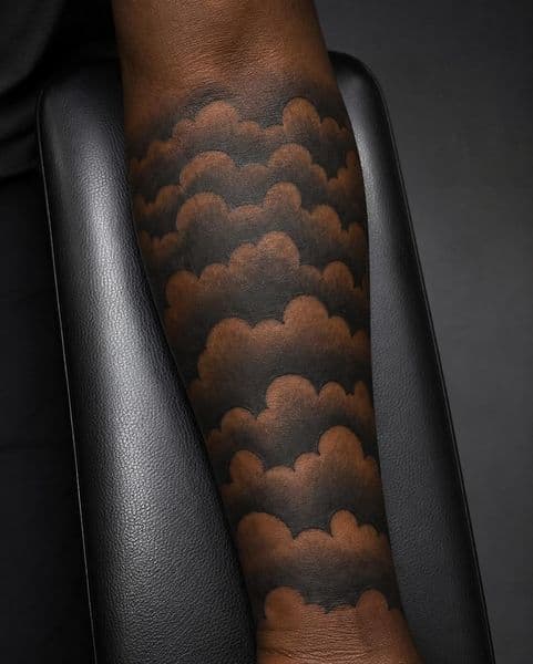 Black-work + Negative Space clouds tattoo on Forearm by Resevoir_tattoo_artist on TattMe