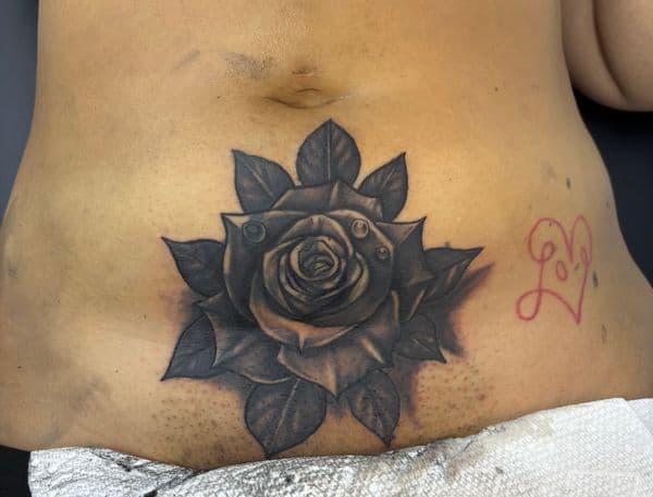 Black & Grey + Realism rose tattoo on Stomach by AnimatedLifestyle on TattMe