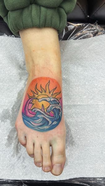 New School + Color sun tattoo on Foot by AnimatedLifestyle on TattMe