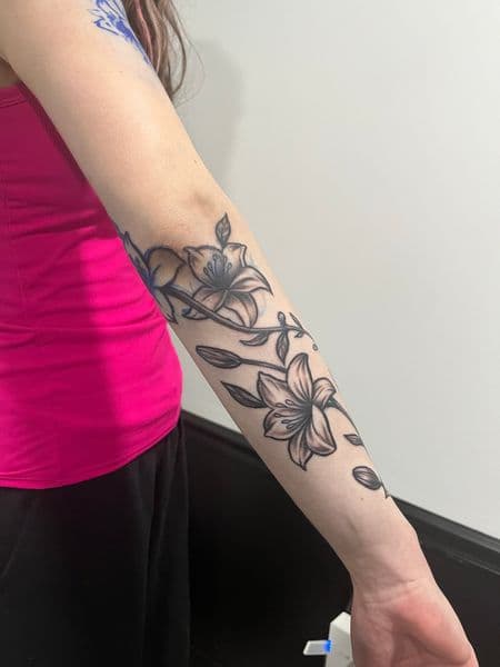 Black & Grey + Illustrative lilies tattoo on Forearm by AnimatedLifestyle on TattMe