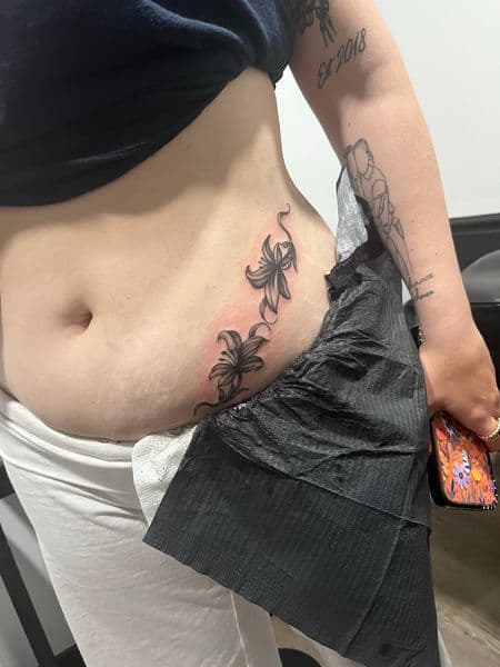 Black & Grey + Floral flowers tattoo on Hip by AnimatedLifestyle on TattMe
