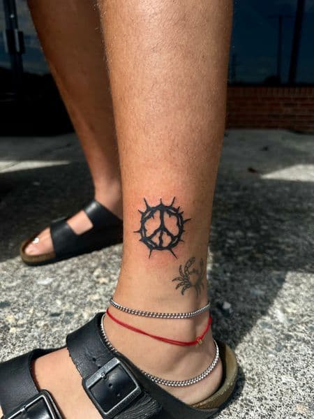 Black-work + Line-work peace symbol tattoo on Calf by jaae_inks on TattMe