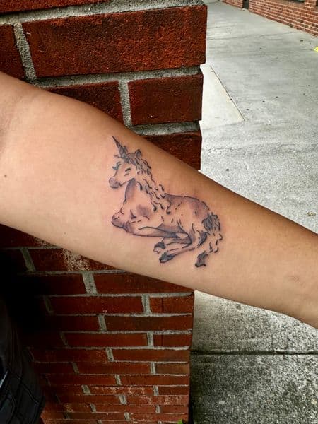 Black & Grey + Illustrative unicorn tattoo on Forearm by jaae_inks on TattMe