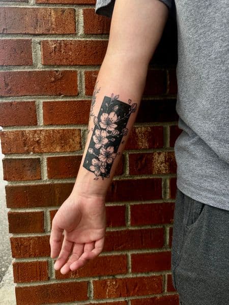 Black-work + Floral cherry blossoms tattoo on Forearm by jaae_inks on TattMe