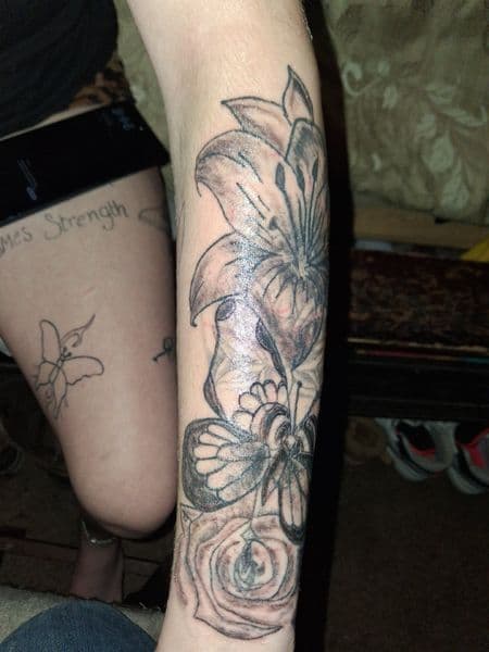 Black & Grey + Illustrative lily tattoo on Forearm by KUSTOM_INK_TATTOOS on TattMe