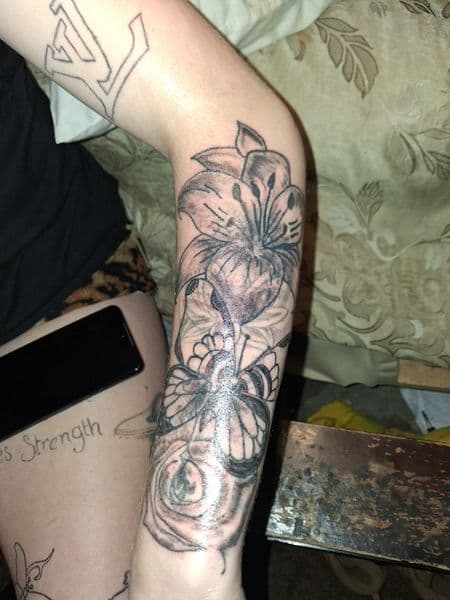 Black & Grey + Floral lily tattoo on Forearm by KUSTOM_INK_TATTOOS on TattMe