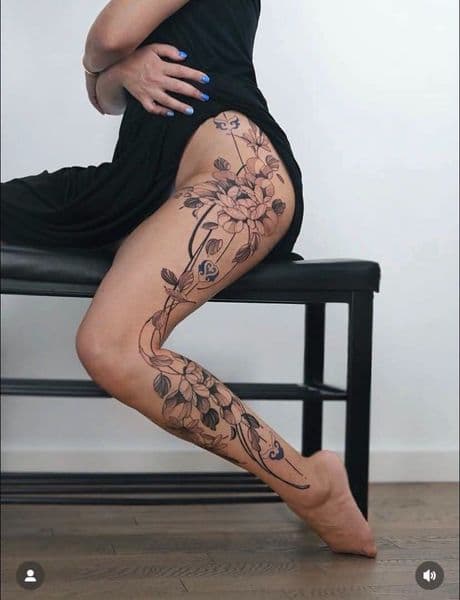 Illustrative + Floral flowers tattoo on Thigh by KUSTOM_INK_TATTOOS on TattMe