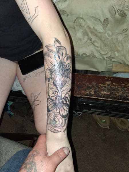 Black & Grey + Illustrative flowers tattoo on Forearm by KUSTOM_INK_TATTOOS on TattMe