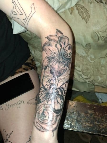 Black & Grey + Floral lily tattoo on Forearm by KUSTOM_INK_TATTOOS on TattMe