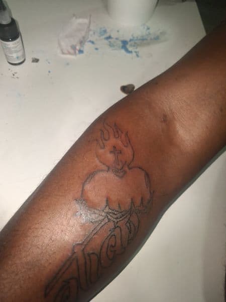 Line-work + Black-work flaming heart tattoo on Forearm by KUSTOM_INK_TATTOOS on TattMe