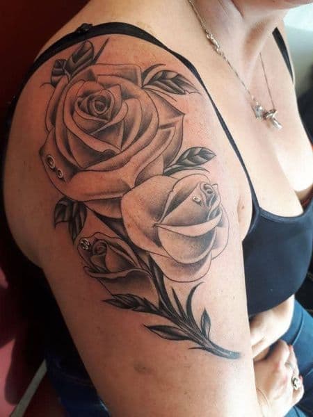 Black & Grey + Floral roses tattoo on Upper Arm by KUSTOM_INK_TATTOOS on TattMe