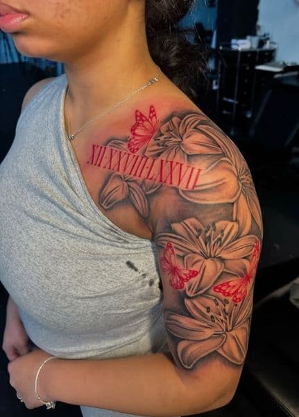 Floral + Black & Grey lilies tattoo on Upper Arm by white..tatt_ink on TattMe