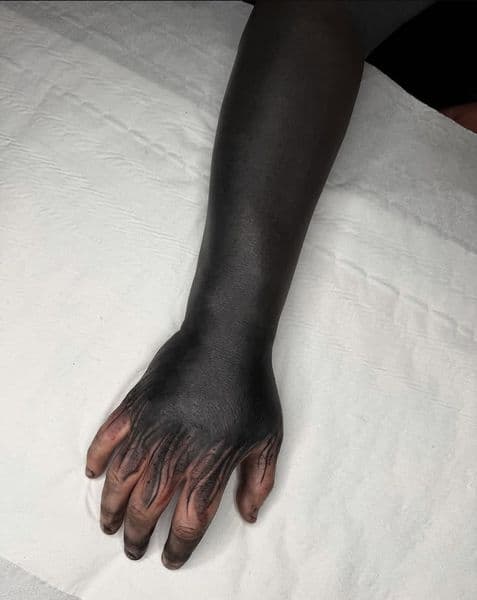 Black-work + Horror blackout tattoo on Hand by chroma_tattoo_parlour on TattMe