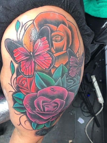 Color + Floral roses tattoo on Upper Arm by ink_by_christian on TattMe