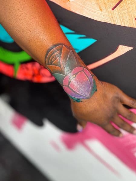 Color + Neo-Traditional flower tattoo on Wrist by ink_by_christian on TattMe