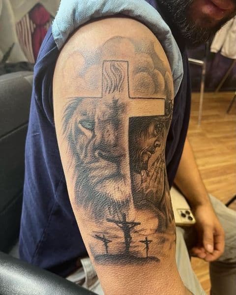 Black & Grey + Realism cross tattoo on Upper Arm by TX8_Tattoos on TattMe