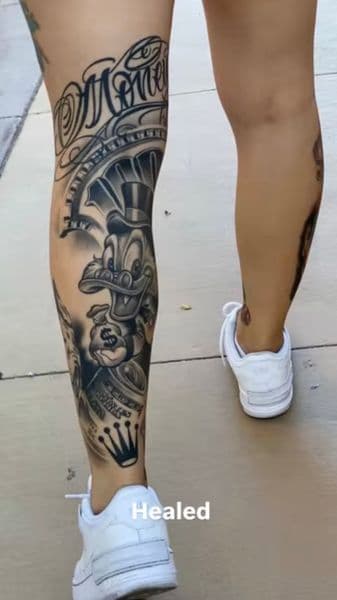 Black & Grey + Illustrative scrooge mcduck tattoo on Calf by Tattoo_Artist_Phoenix on TattMe