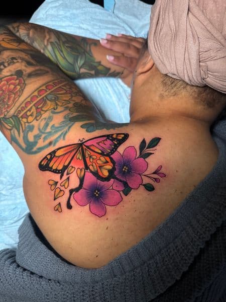 Color + Floral butterfly tattoo on Shoulder Blade by transcendingink on TattMe