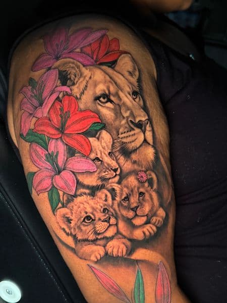 Color + Realism lioness tattoo on Half Sleeve by transcendingink on TattMe