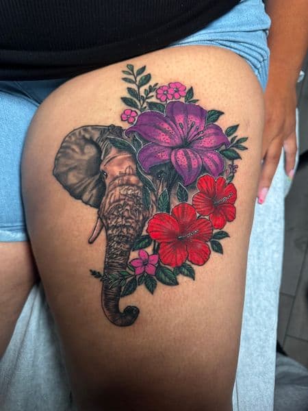 Color + Floral elephant tattoo on Thigh by transcendingink on TattMe