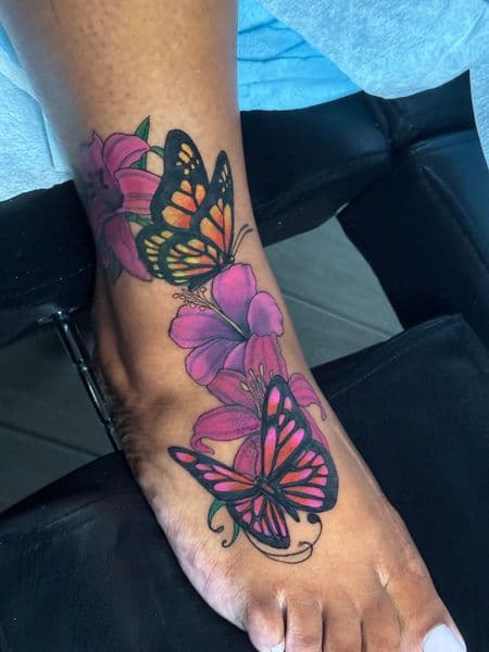 Color + Floral butterflies tattoo on Foot by transcendingink on TattMe